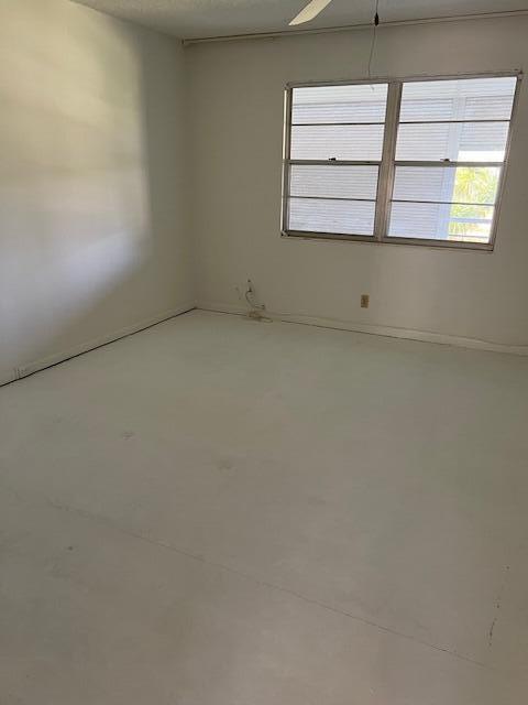 spare room featuring concrete flooring