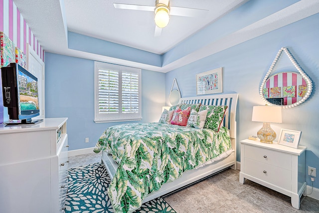 bedroom featuring ceiling fan and a textured ceiling