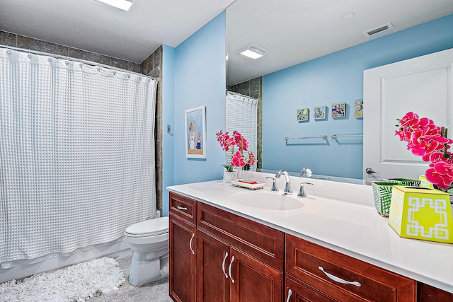 bathroom with vanity, toilet, and a shower with shower curtain