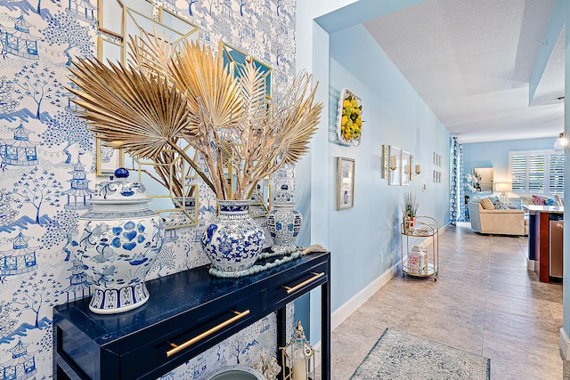 interior space featuring tile patterned flooring and a textured ceiling