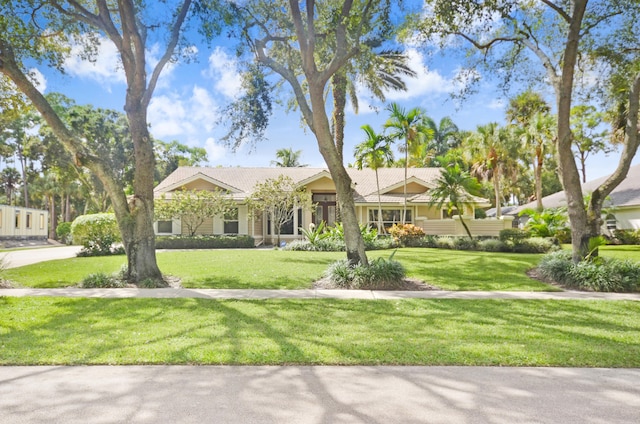 single story home featuring a front yard