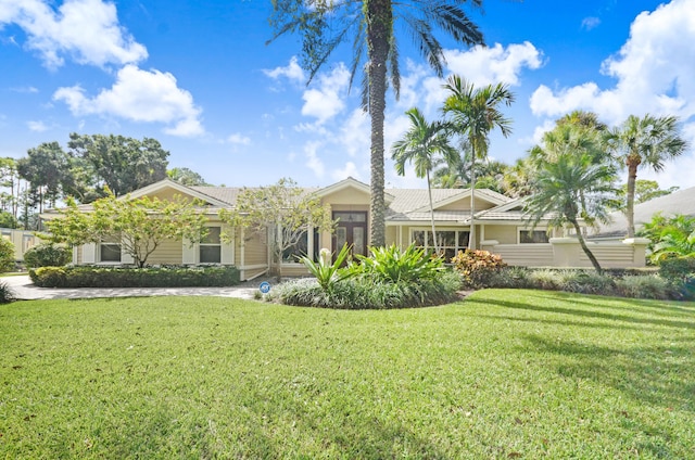 rear view of house with a yard