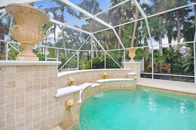 view of pool featuring pool water feature and glass enclosure