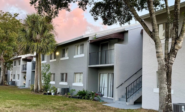 outdoor building at dusk with central air condition unit