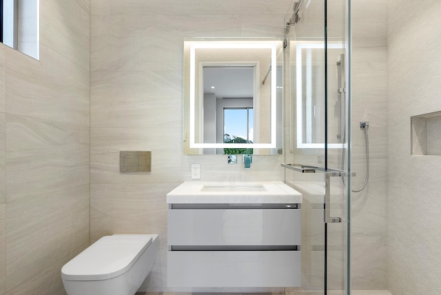 bathroom with an enclosed shower, tile walls, vanity, and toilet