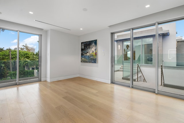 unfurnished room featuring light hardwood / wood-style flooring