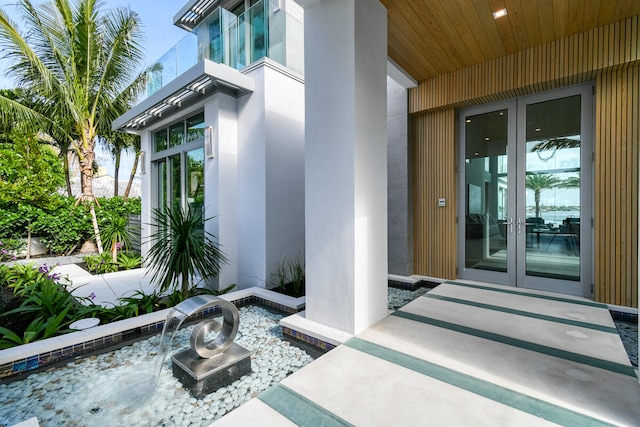 entrance to property featuring a patio area and french doors