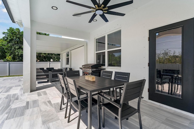 view of patio featuring ceiling fan, grilling area, and an outdoor living space