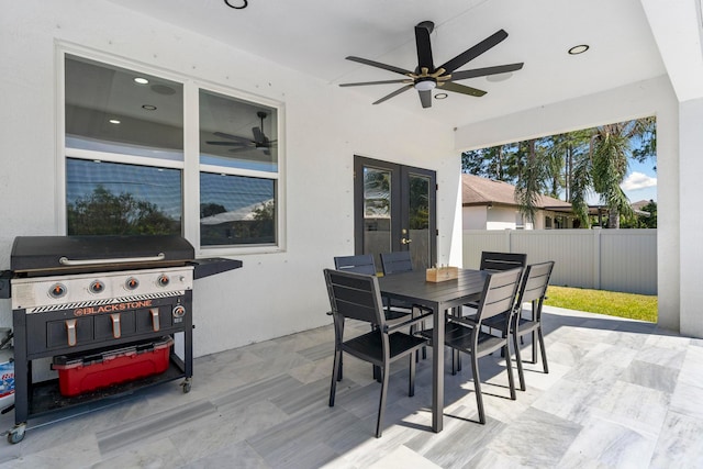 view of patio with ceiling fan and area for grilling