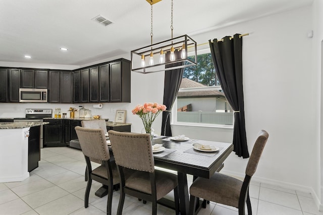 dining area with light tile patterned floors