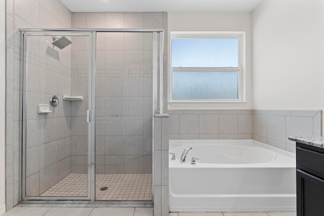 bathroom with vanity, tile patterned flooring, and independent shower and bath