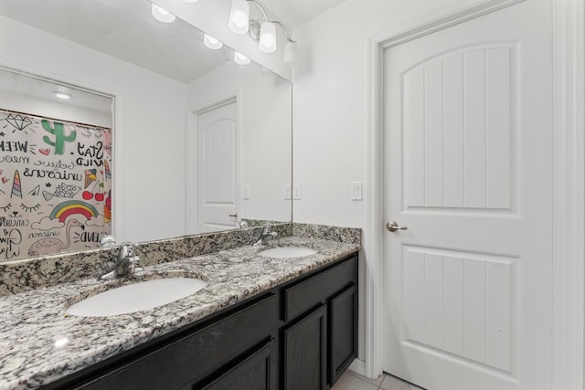 bathroom featuring vanity and tile patterned flooring