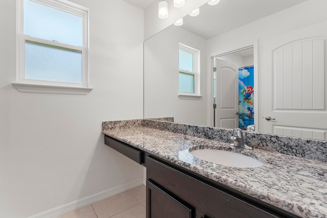 bathroom featuring vanity, tile patterned floors, and a shower with curtain