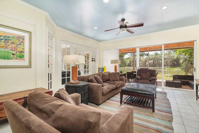 tiled living room with ornamental molding and ceiling fan