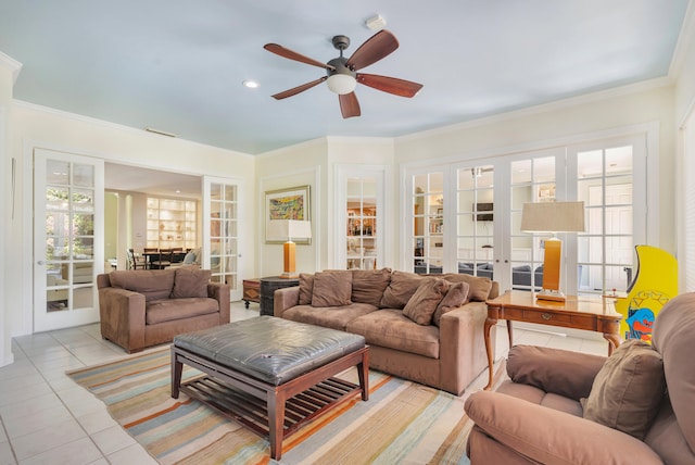 living room with french doors, ornamental molding, ceiling fan, and light tile floors