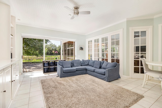 tiled living room featuring ceiling fan, french doors, crown molding, and sink