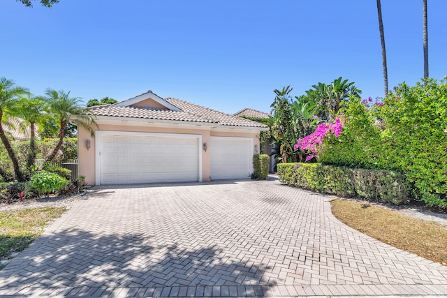 view of front of property with a garage