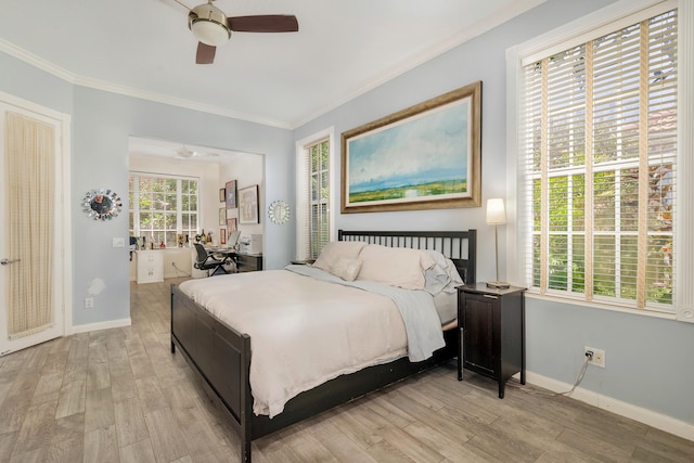 bedroom featuring crown molding, french doors, light wood-type flooring, and ceiling fan