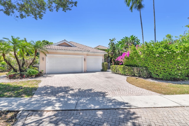 view of front of property with a garage