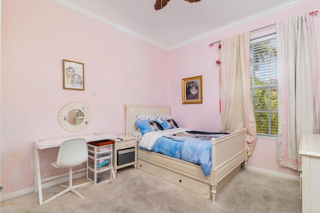 carpeted bedroom featuring ornamental molding and ceiling fan