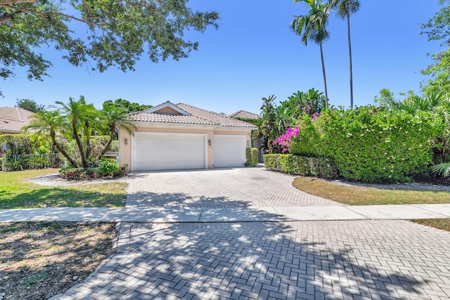 view of front of property featuring a garage