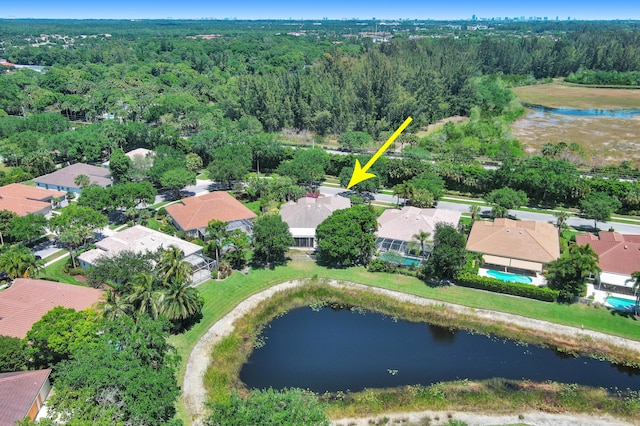 birds eye view of property featuring a water view