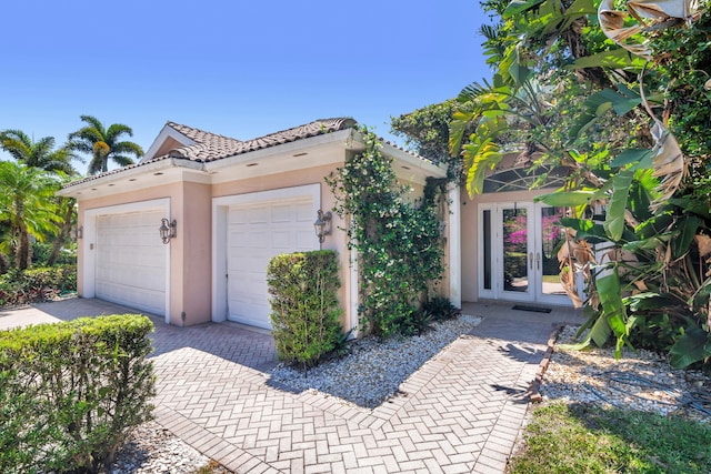 view of front of house featuring french doors and a garage