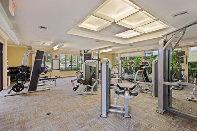 exercise room with coffered ceiling, ornamental molding, and carpet floors