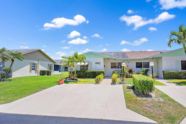 ranch-style house with a front lawn