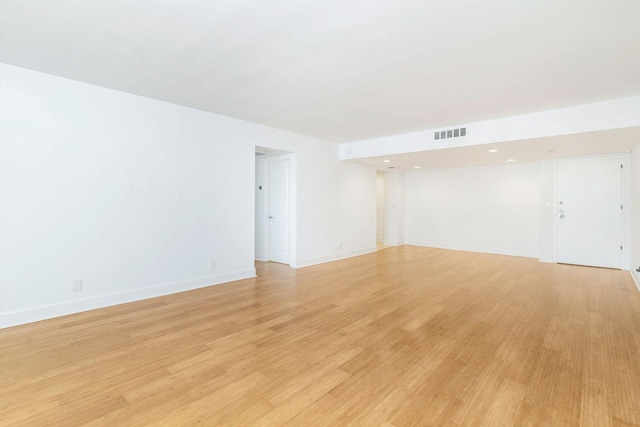 spare room with light hardwood / wood-style flooring