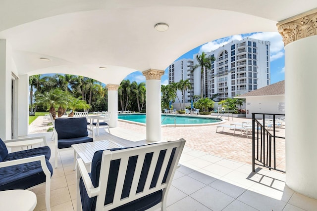 view of patio / terrace with a community pool and an outdoor hangout area