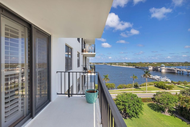 balcony featuring a water view