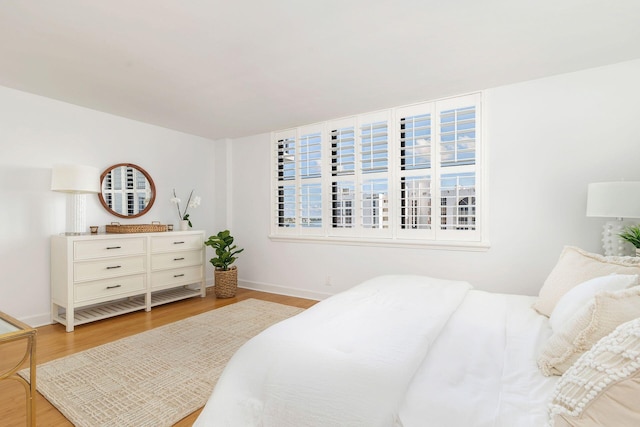 bedroom with light hardwood / wood-style flooring