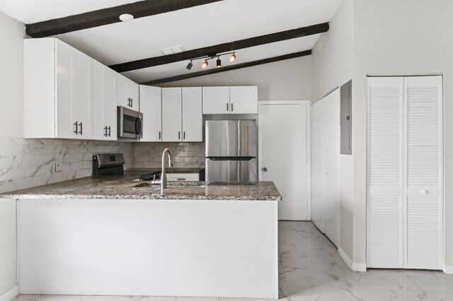 kitchen featuring beamed ceiling, appliances with stainless steel finishes, white cabinets, and light tile floors