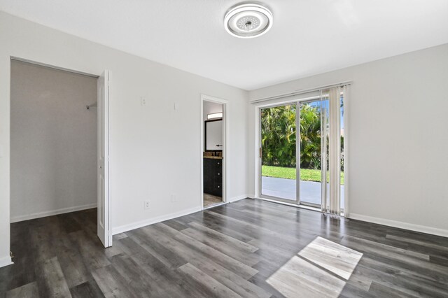 empty room featuring dark hardwood / wood-style flooring