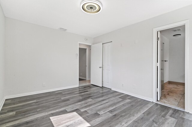 interior space featuring hardwood / wood-style floors and a closet