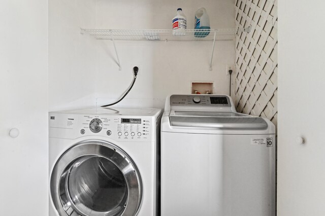 laundry room with hookup for an electric dryer, independent washer and dryer, and hookup for a washing machine