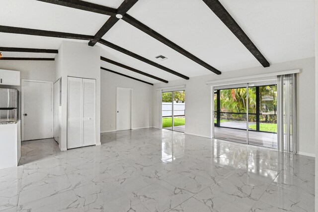 tiled spare room featuring high vaulted ceiling and beamed ceiling