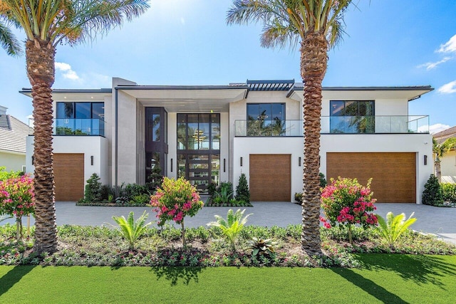 contemporary house with a balcony and a garage