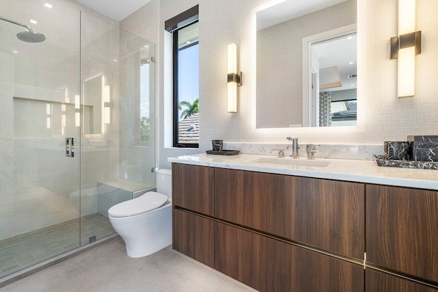 bathroom with tile patterned flooring, vanity, an enclosed shower, and toilet