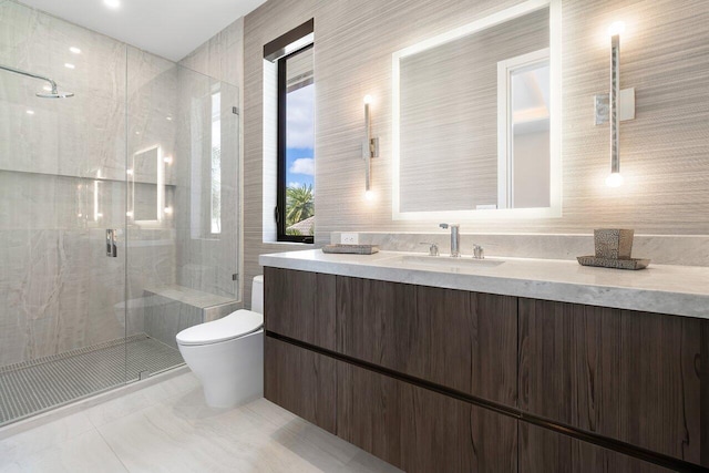 bathroom featuring vanity, toilet, and an enclosed shower