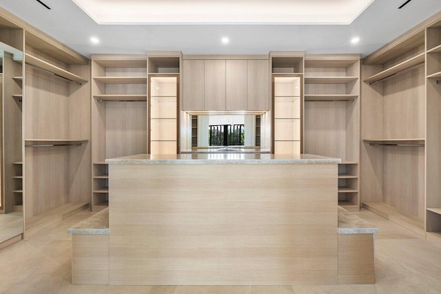 spacious closet featuring light tile patterned flooring