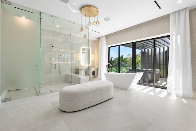 bathroom featuring french doors and separate shower and tub