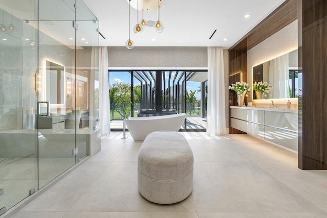 bathroom featuring vanity and separate shower and tub