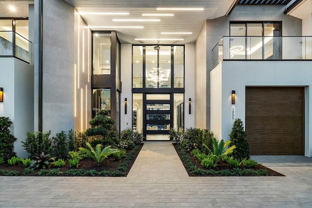 view of exterior entry featuring a garage