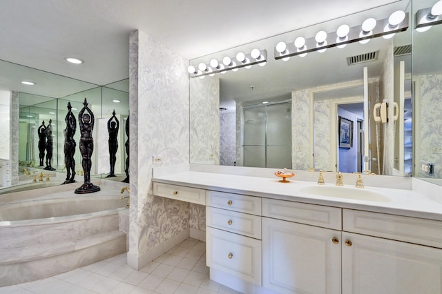 bathroom featuring a bath to relax in, tile floors, and vanity