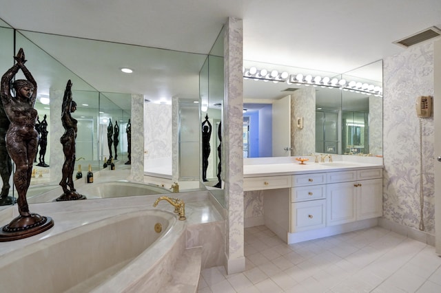 bathroom featuring tile flooring, vanity with extensive cabinet space, and a washtub