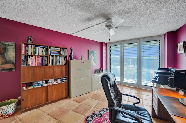 office area with ceiling fan, light tile floors, and a textured ceiling