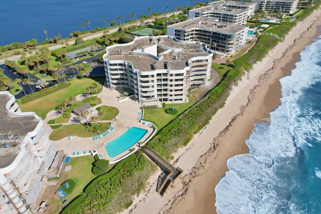 bird's eye view with a water view and a view of the beach