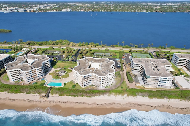 bird's eye view featuring a beach view and a water view